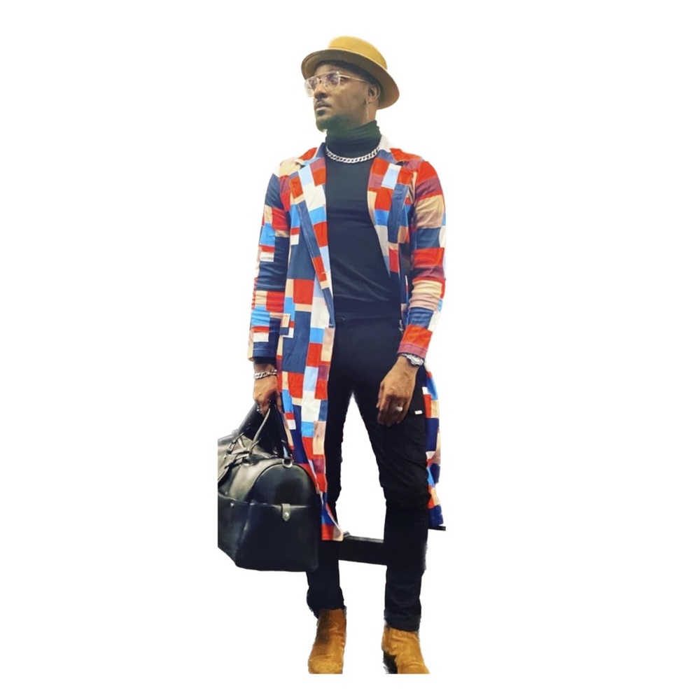 Warm, chic, color-blocked trench coat features a buttoned front.  Soft, warm